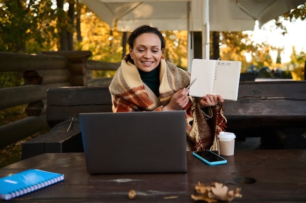 A young woman using her laptop to volunteer remotely, helping a charity with their social media efforts. She is sitting at her desk with a focused expression, and the background is a modern, organized home office.