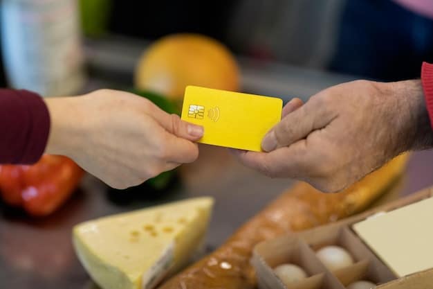 A close-up shot of hands exchanging a grocery store gift card over a brightly lit display of fresh produce in a grocery store. The focus is on the act of giving and receiving, emphasizing the personal connection between individuals.