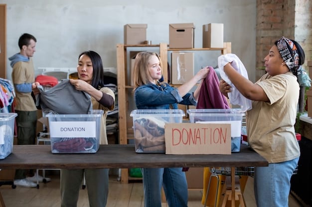 A group of volunteers is sorting clothing donations in a warehouse labeled with a local charity's name. The scene is organized and efficient, highlighting their dedication to processing donations and supporting those in need.
