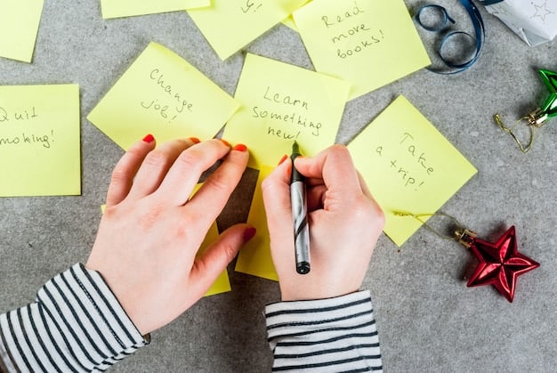 A top-down shot of a person's hands writing positive affirmations on brightly colored sticky notes with a black marker. The background includes a desk with a notebook, a coffee cup, and a pen holder, creating a cozy and creative atmosphere.