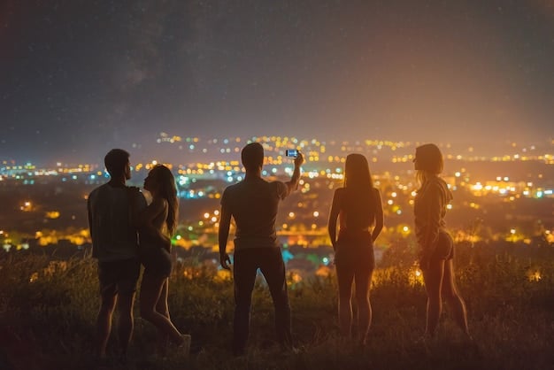 A group of people looking through telescopes in a field at night, with a visible galaxy in the background. The atmosphere is one of wonder and excitement.