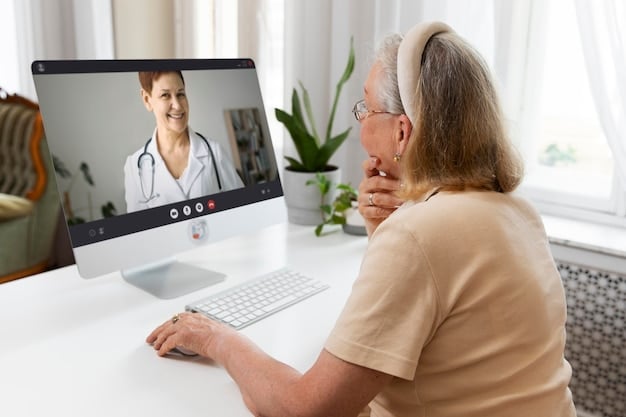 A screenshot of a telehealth consultation on a laptop screen, showing a nurse in a well-lit office and a patient in a rural home setting, both smiling and engaged in conversation.