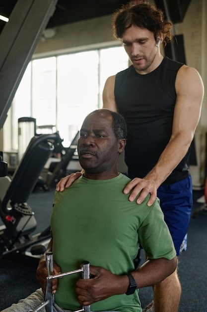 The athlete in a gym, working with a physical therapist. They are using specialized equipment to strengthen their muscles. The athlete's face is focused and determined.
