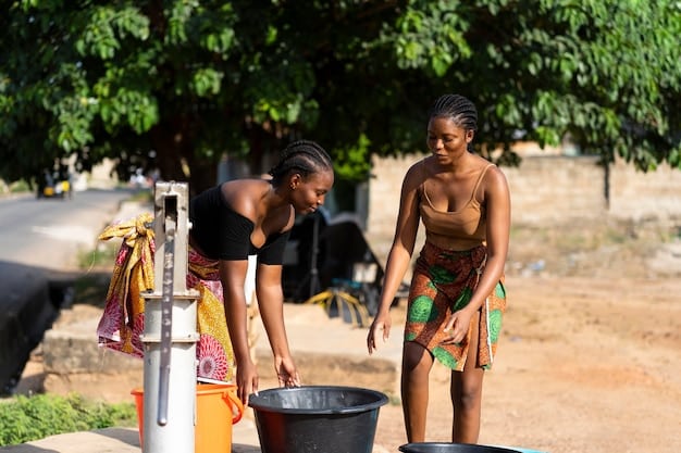 A group of local villagers, including women and children, gathered around the water filtration system, smiling and interacting with the US engineer. They are actively participating in a training session, learning how to maintain and operate the system, showcasing community involvement and empowerment.