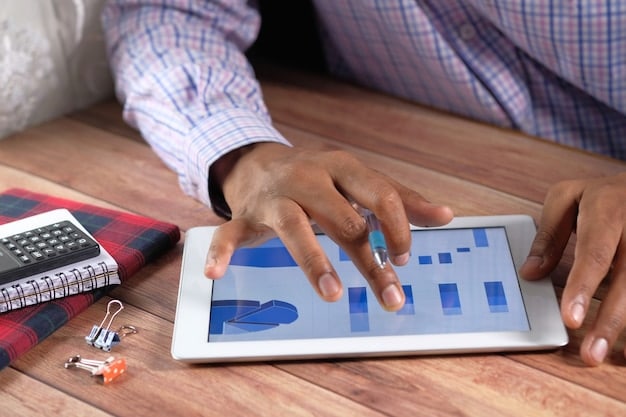 A person looking at a digital dashboard displaying various financial charts, specifically showing a reduction in monthly student loan payments due to an IDR plan, highlighting financial relief.