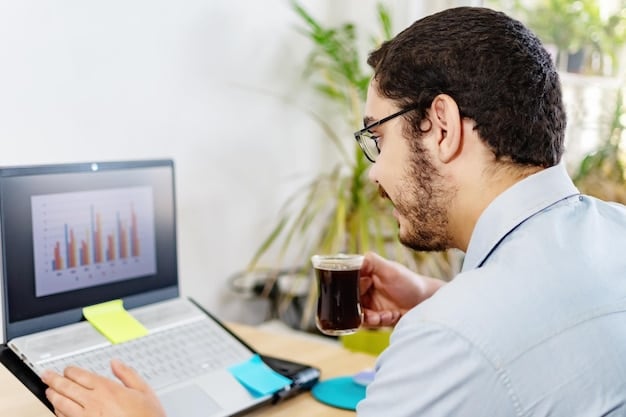 A young person looking thoughtfully at a computer screen displaying charts and graphs related to financial planning, with a calculator and coffee nearby, symbolizing careful money management.