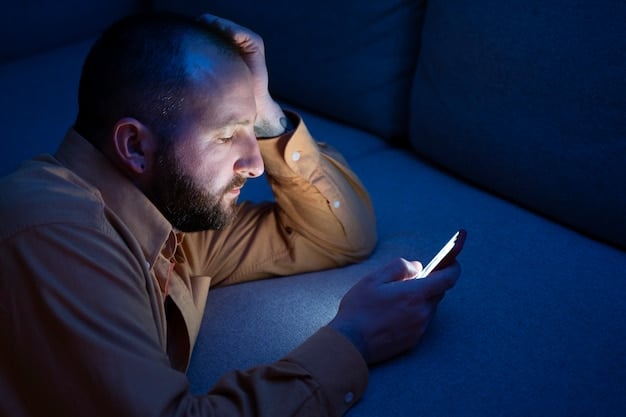 A young adult looking tired while scrolling on a smartphone late at night, with a faint blue light emanating from the screen, illustrating the impact of technology on sleep.