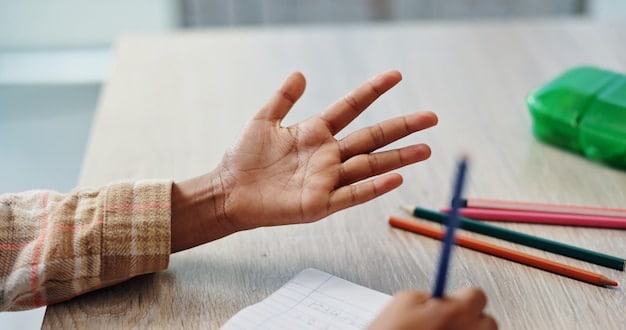 A stressed student's hand gripping a pencil tightly over a test paper, with blurred background suggesting a high-pressure testing environment.