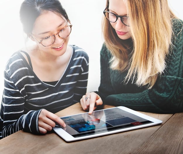 A teacher and student collaboratively reviewing a digital portfolio on a tablet, showcasing a more engaged and personalized assessment approach.