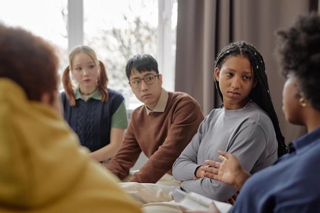 A calm and focused young student in a classroom setting, actively participating in a group discussion, showing signs of confident communication and engagement.