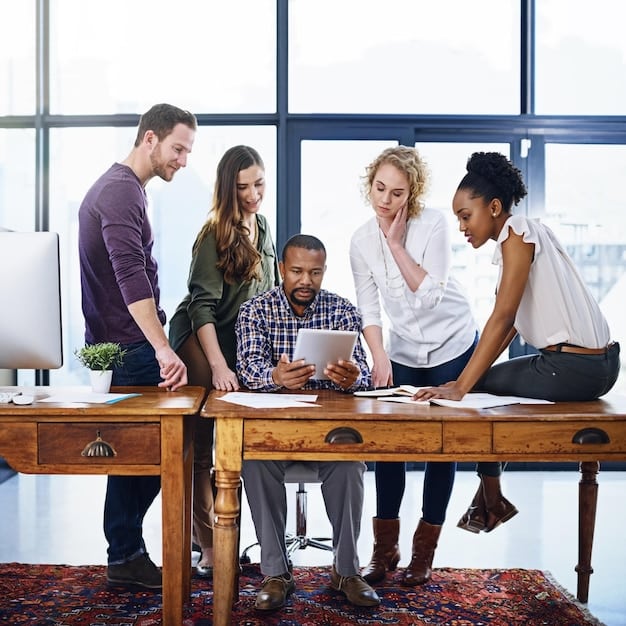A diverse group of professionals working in an office setting, representing the talent and skills that immigrants contribute to the US workforce. The image is bright and modern, highlighting collaboration and innovation in various fields relevant to Immigration Policy Update: Key Changes and Their Impact on the US Workforce.