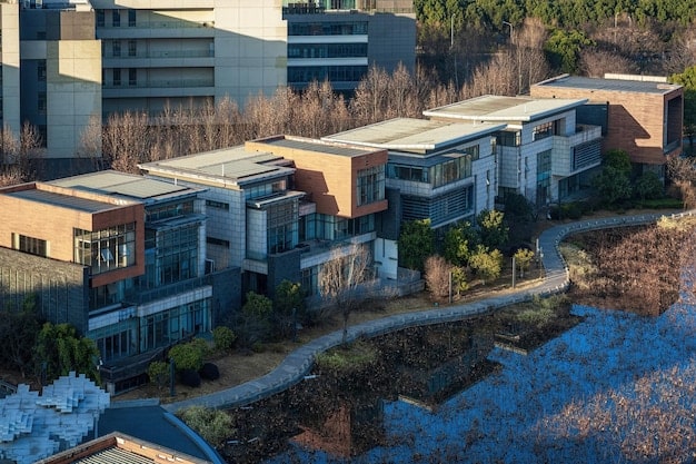 A photo showcasing a new, mixed-income housing development with modern architecture. The development includes various types of housing, such as apartments and townhouses, with well-maintained landscaping and community amenities. The image illustrates successful affordable housing projects that could result from new federal programs.