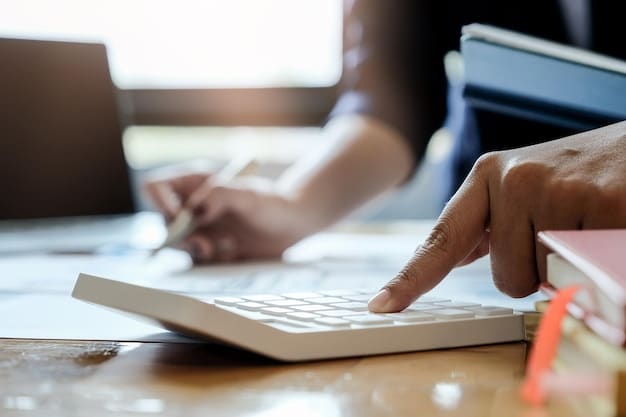 A close-up shot of a person's hands using a calculator and reviewing financial documents on a desk, emphasizing the meticulous planning involved in managing a 401(k). A graph showing growth trends is visible in the background, further highlighting the theme of Retirement Planning in 2025: Personal Finance Strategies for Maximizing Your 401(k) Contributions.