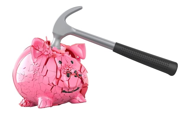 A detailed close-up shot of a piggy bank with a crack running down its side, symbolizing the fragility of an inadequate emergency fund within the context of 'Personal Finance Warning: Avoid These 3 Common Money Mistakes That Cost Americans Thousands'. Coins are scattered around the base, suggesting depleted savings.