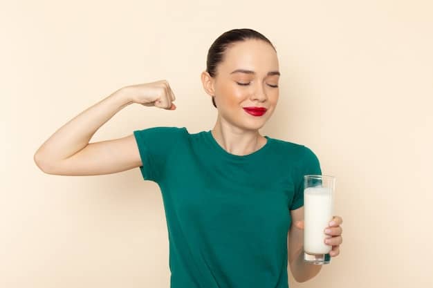 A person holding a glass of milk next to a bottle of vitamin D supplements. The scene is set in a cozy, naturally lit kitchen, suggesting a routine of daily vitamin intake. The milk and supplements convey the message of boosting Vitamin D levels during winter and relate to 'Boost Your Immunity: 5 Essential Vitamins You're Probably Missing This Winter'.