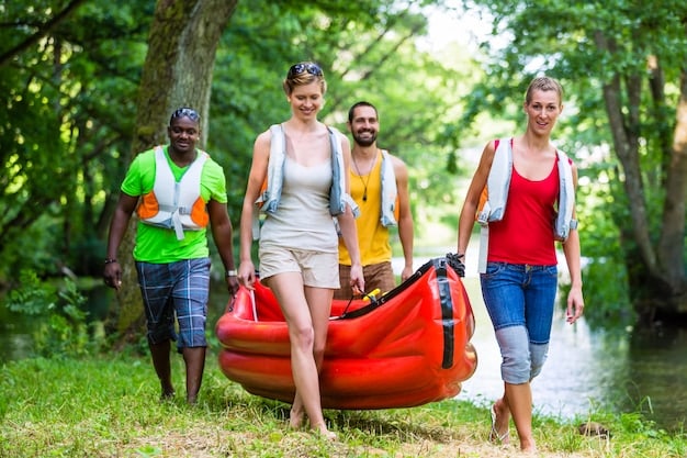 A diverse group of people enjoying outdoor activities like hiking and swimming, all wearing eco-friendly sunscreens. The scene showcases the use of products that support both personal protection and environmental responsibility aligned with Protecting Your Skin: The Latest Sunscreen Recommendations for 2025.