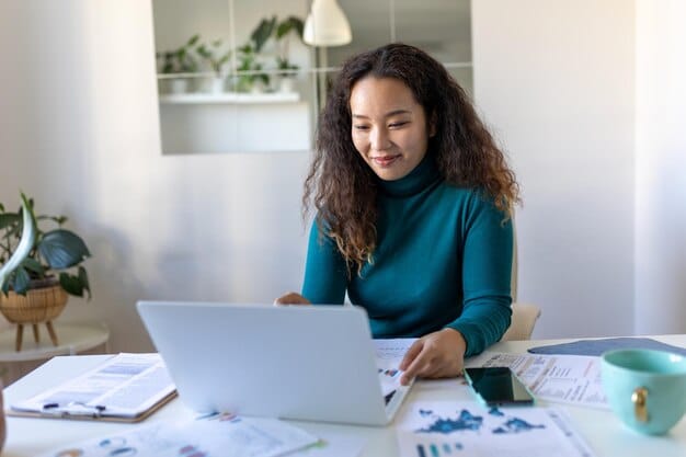 A young professional smiling confidently while reviewing their finances on a laptop, with a graph showing manageable student loan payments in the background, under the title