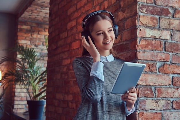 A student wearing headphones and using an AI-powered learning platform on a tablet. The platform is displaying personalized lessons and providing real-time feedback. The background shows a supportive teacher assisting other students. Focus on personalized learning paths and adaptive content. Relate to Understanding the Impact of AI on US Education: 3 Ways Technology is Reshaping the Classroom in 2025.