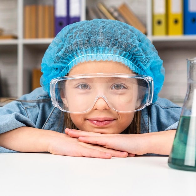 A child wearing safety goggles and a lab coat conducting a science experiment at a home lab setup. The child has a focused and excited expression. Various beakers, test tubes, and other lab equipment are visible.