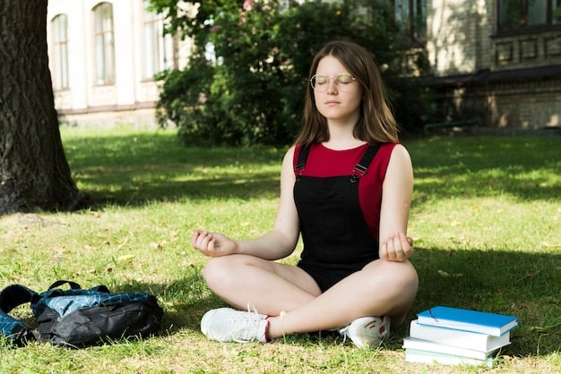 A student meditating outdoors in a serene park. The student is sitting cross-legged, eyes closed, and hands resting on their knees. The background includes lush greenery and a clear blue sky, symbolizing a calm and peaceful environment conducive to stress reduction and mental clarity.
